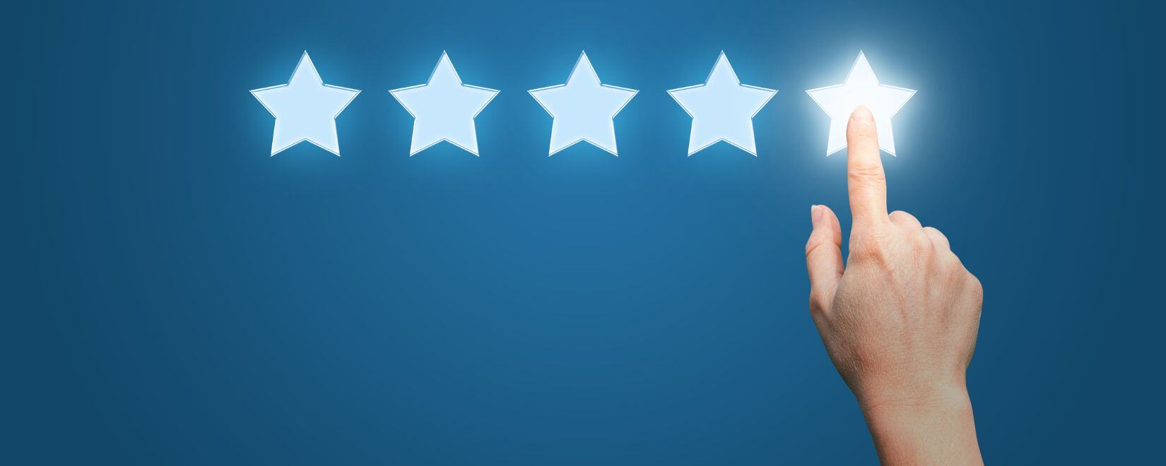 Five rating stars with a hand clicking the fifth star and lighting it up